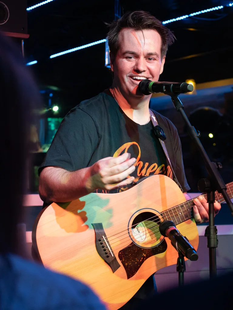 Ben Hawes performing live on stage